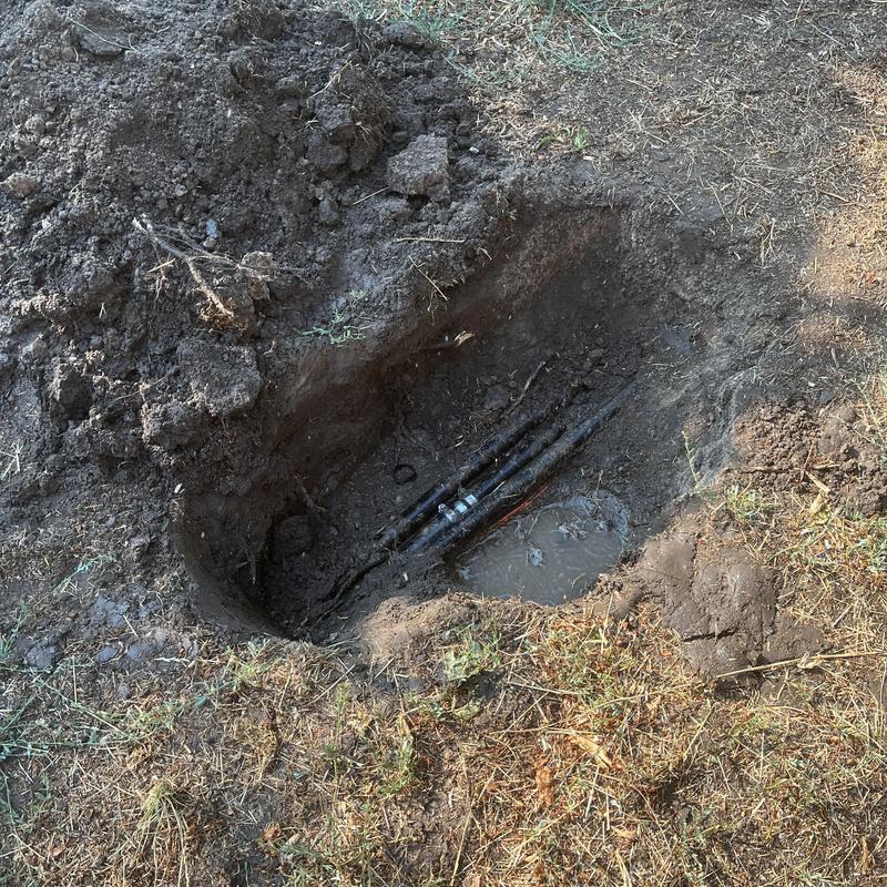 PEX water service underground with backflow valve installation