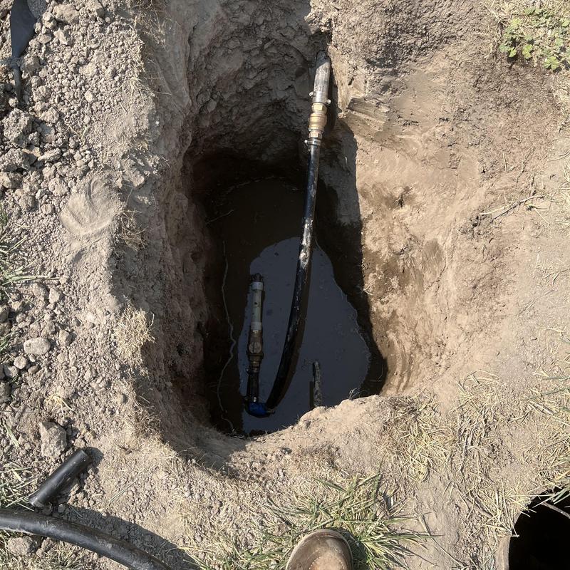 Backflow valve underground with PEX water line