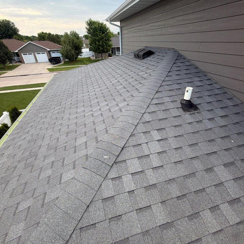 Asphalt shingle roof with vent and pipe flashing Asphalt shingle roof with vent and pipe flashing