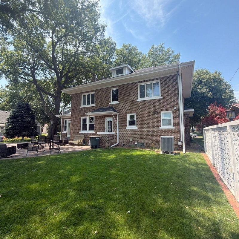 Brick residential roof with gutters and no damage visible Brick residential roof with gutters and no damage visible