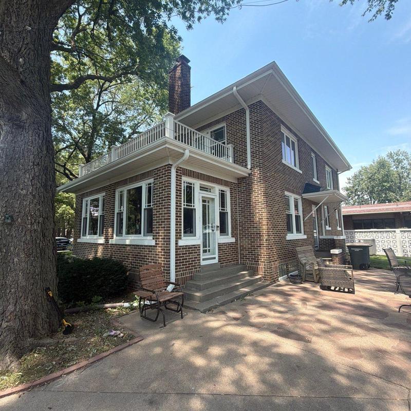 Brick house roof and gutter inspection exterior view Brick house roof and gutter inspection exterior view