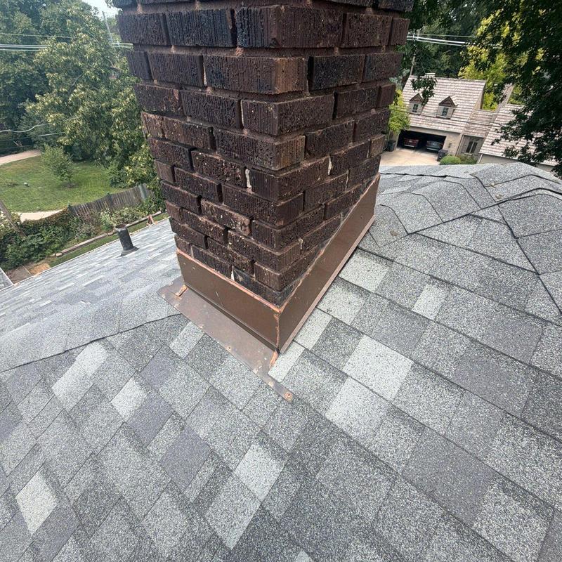 Chimney flashing on asphalt shingle roof Chimney flashing on asphalt shingle roof