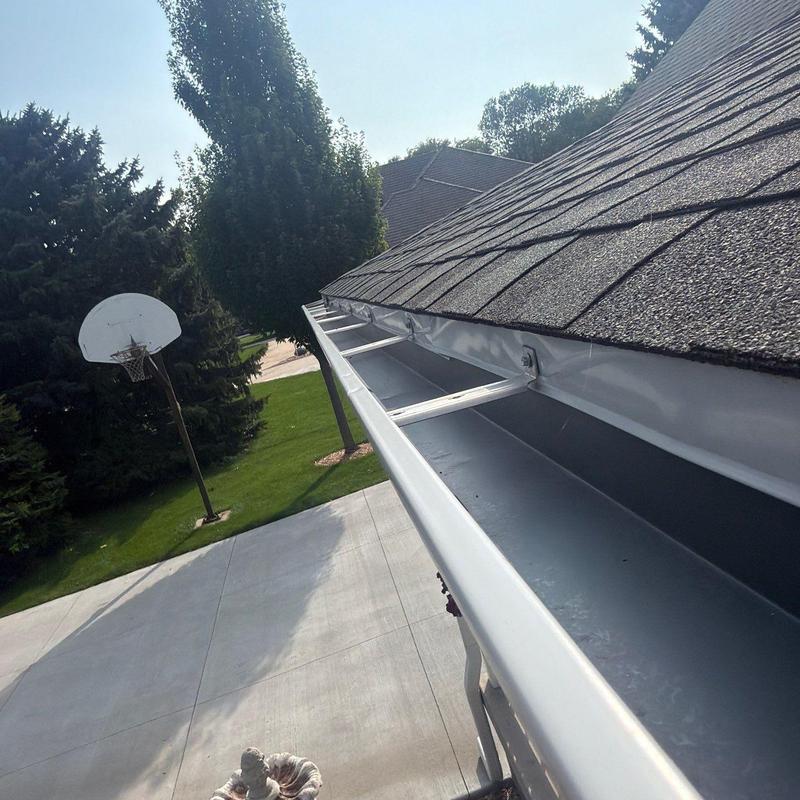 Roof gutters and shingles inspection on residential home Roof gutters and shingles inspection on residential home