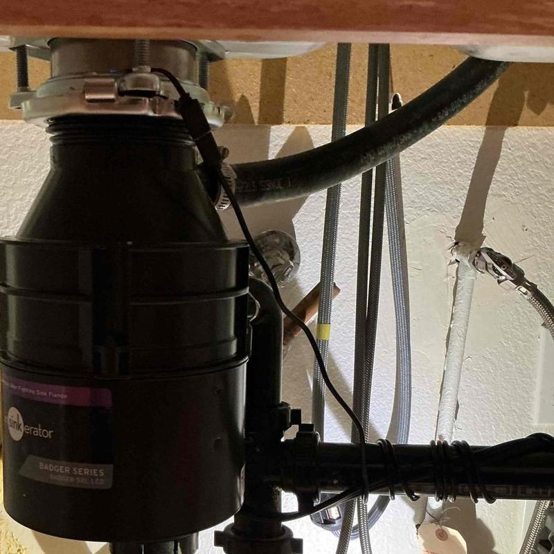 Garbage disposal installation under kitchen sink Garbage disposal installation under kitchen sink
