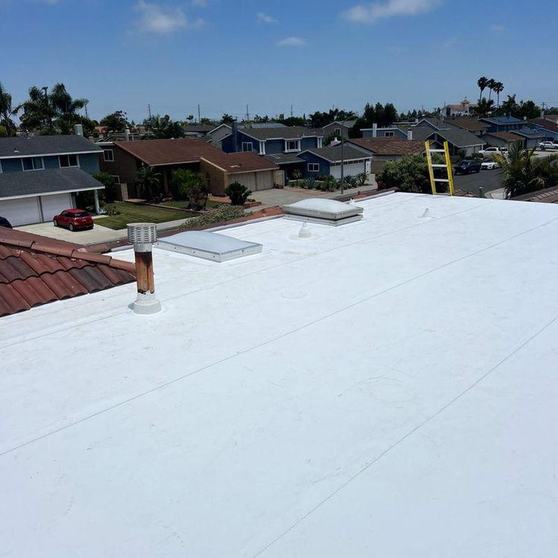 Flat roof membrane installation on residential home Flat roof membrane installation on residential home