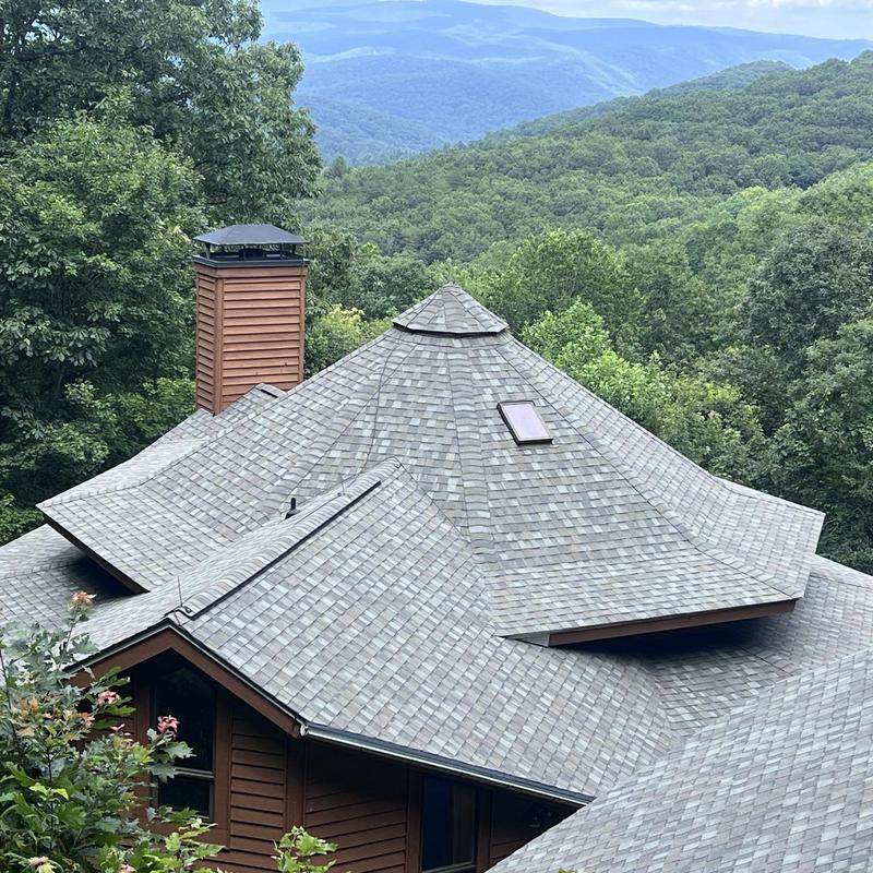 Architectural shingle roof with skylight and chimney