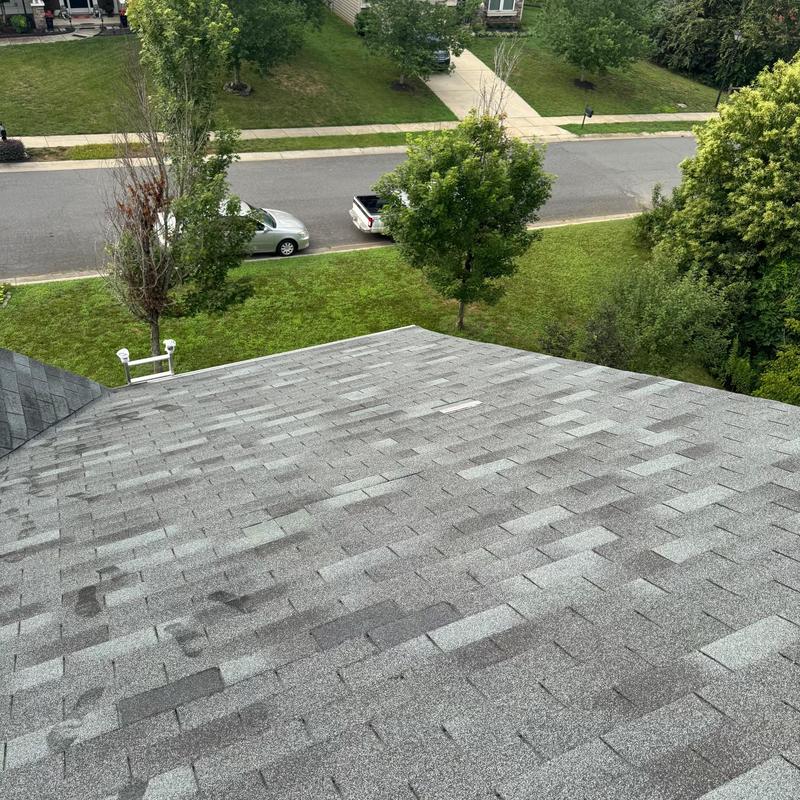 Three tab shingles roof with missing tabs after wind
