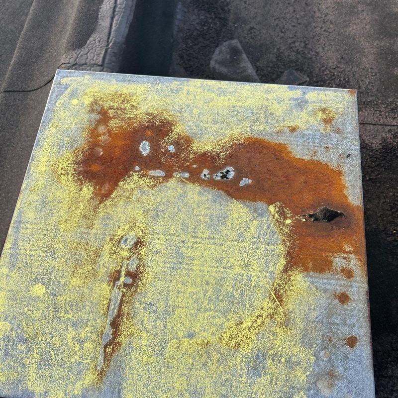 Metal flashing with rust and corrosion damage