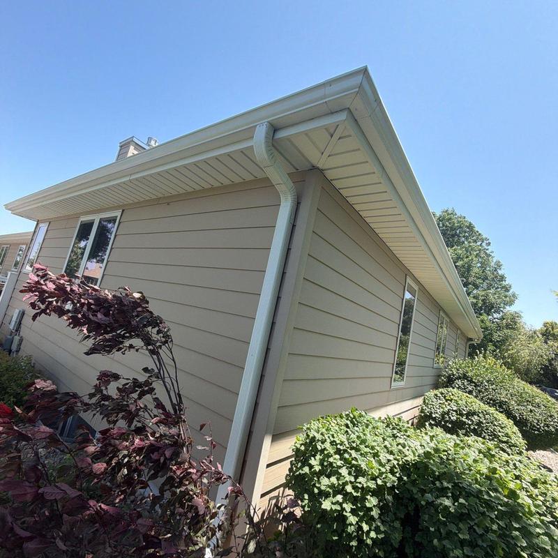 Gutter and downspout system on residential house Gutter and downspout system on residential house