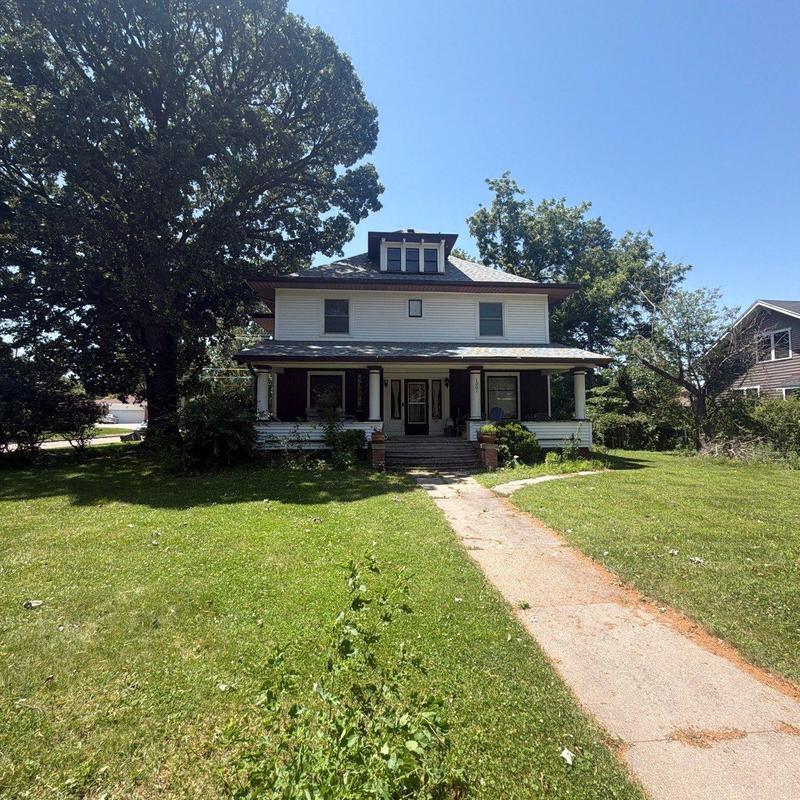 Roof shingles on residential house with front yard Roof shingles on residential house with front yard