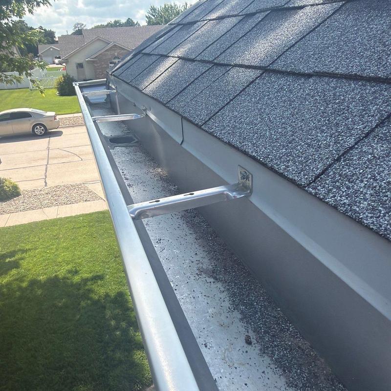 Metal roof gutter with mounting brackets in Hastings, NE Metal roof gutter with mounting brackets in Hastings, NE