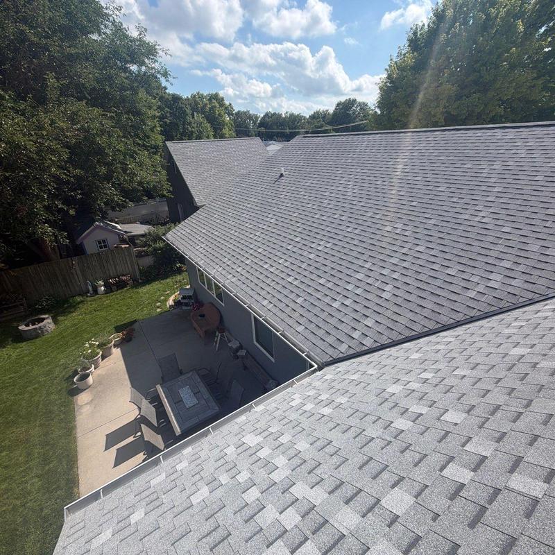 Asphalt shingle roof with patio and backyard view Asphalt shingle roof with patio and backyard view