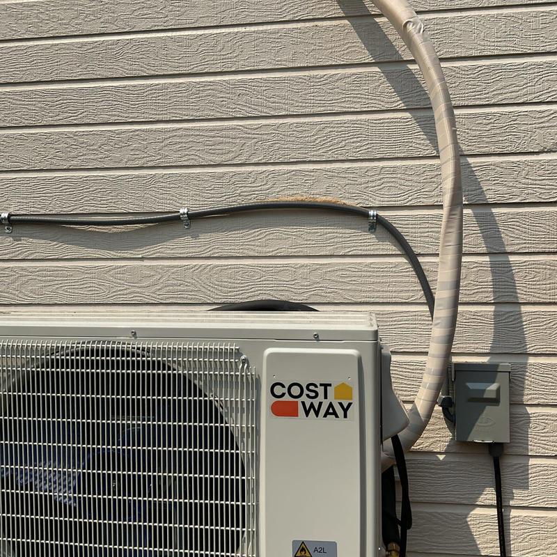 Head unit drain and refrigerant lines on exterior wall