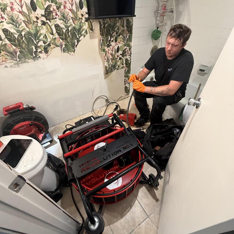 Sewer line descaling and camera inspection in bathroom