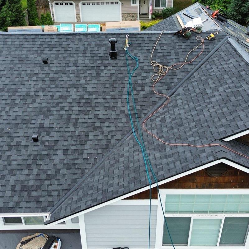 Shingle roof installation with tools and materials
