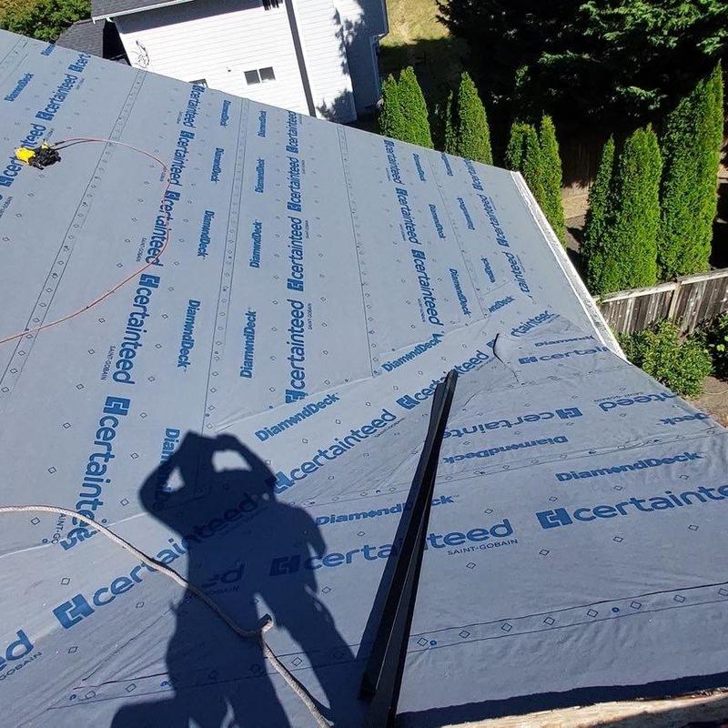 Roof underlayment installation on residential roof