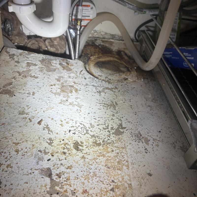 Waterline under kitchen sink with floor damage