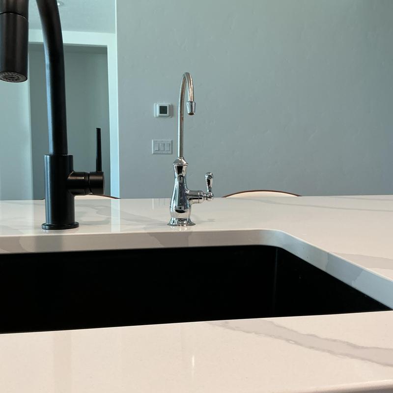 Reverse osmosis faucet installed on kitchen countertop Reverse osmosis faucet installed on kitchen countertop