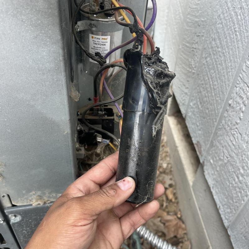 Burnt air conditioner capacitor during HVAC service repair Burnt air conditioner capacitor during HVAC service repair