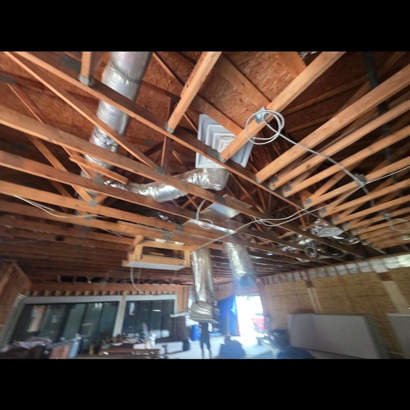 Ductwork and ceiling joists in commercial building interior