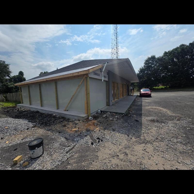 Roof system installation on gas station building