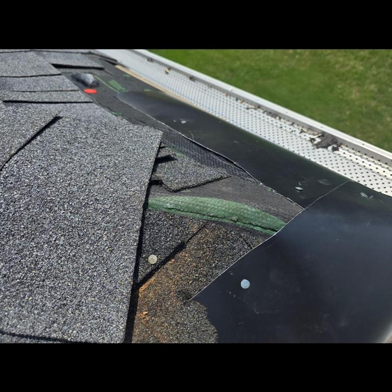 Roof ridge metal flashing installed over shingles