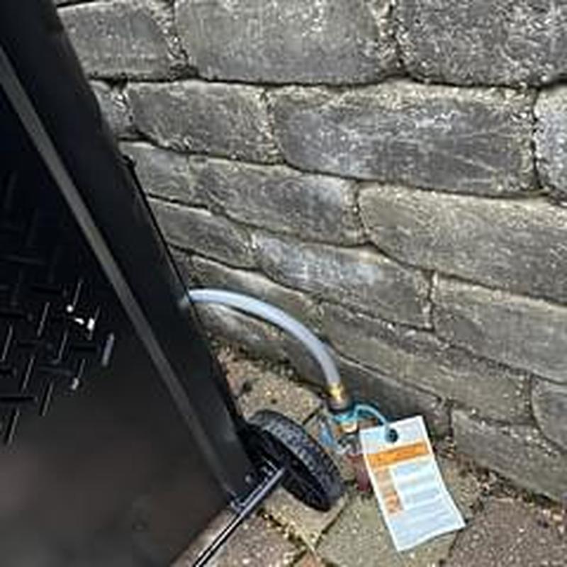 Gas grill quick connect fitting attached to gas line