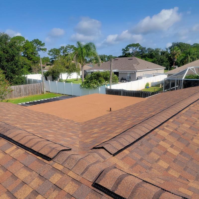 Roof ridge vent installation on asphalt shingle roof Roof ridge vent installation on asphalt shingle roof