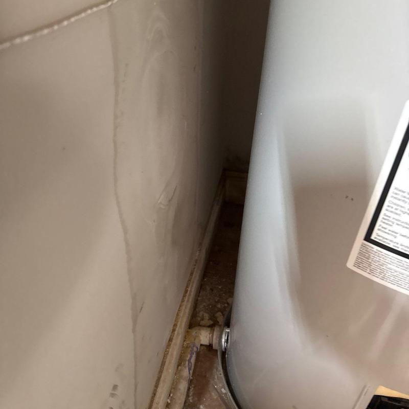 Water heater pipe corrosion and wall water damage
