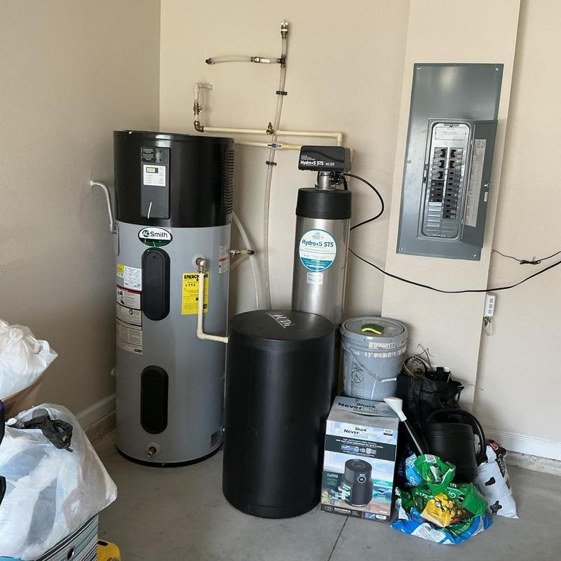 Water heater reset at residential utility room with breaker panel Water heater reset at residential utility room with breaker panel