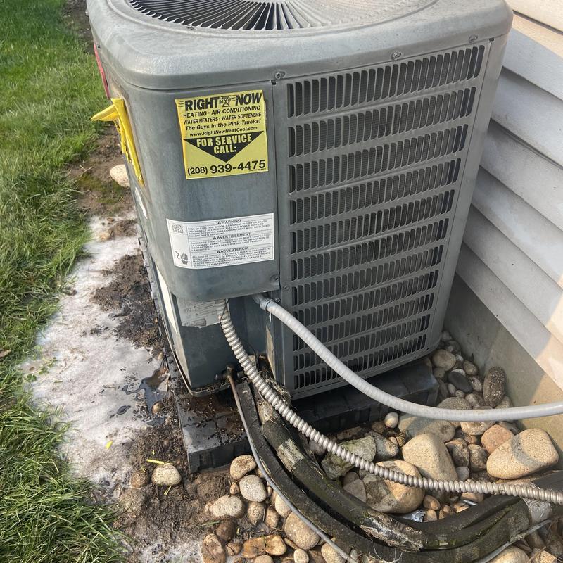 Outdoor air conditioner condenser unit with service lines Outdoor air conditioner condenser unit with service lines