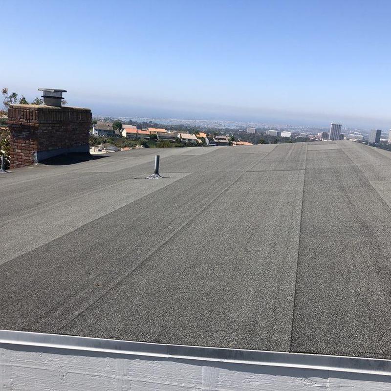 Flat roofing system with chimney vent in Newport Beach Flat roofing system with chimney vent in Newport Beach