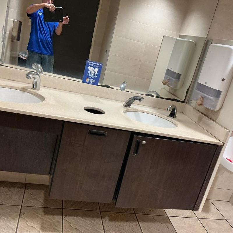 Soap dispenser and dual sink faucet in restroom Soap dispenser and dual sink faucet in restroom