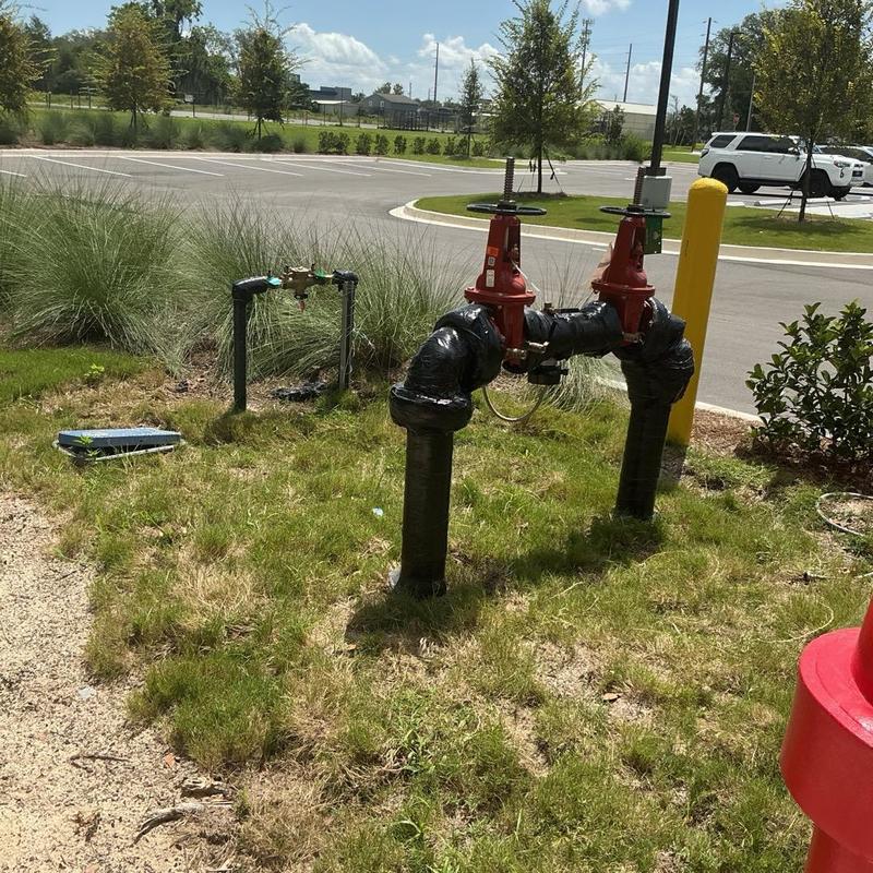 Backflow prevention valves with insulation wrap outdoors Backflow prevention valves with insulation wrap outdoors