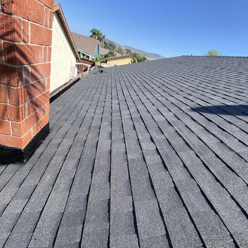 Shingle roof installation with chimney flashing in Newport Beach Shingle roof installation with chimney flashing in Newport Beach