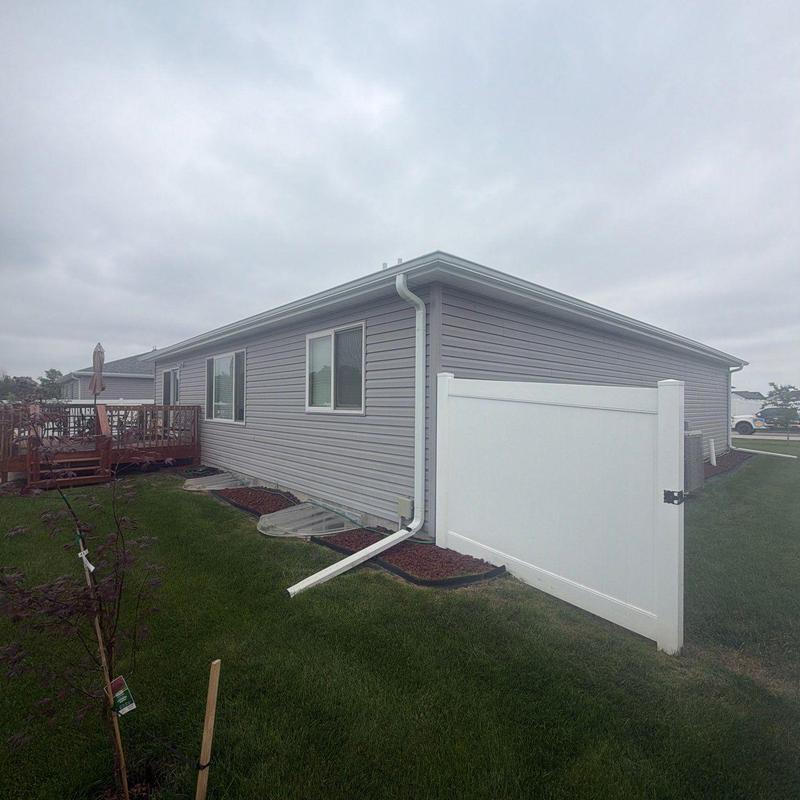 Vinyl siding and gutter inspection on house exterior Vinyl siding and gutter inspection on house exterior
