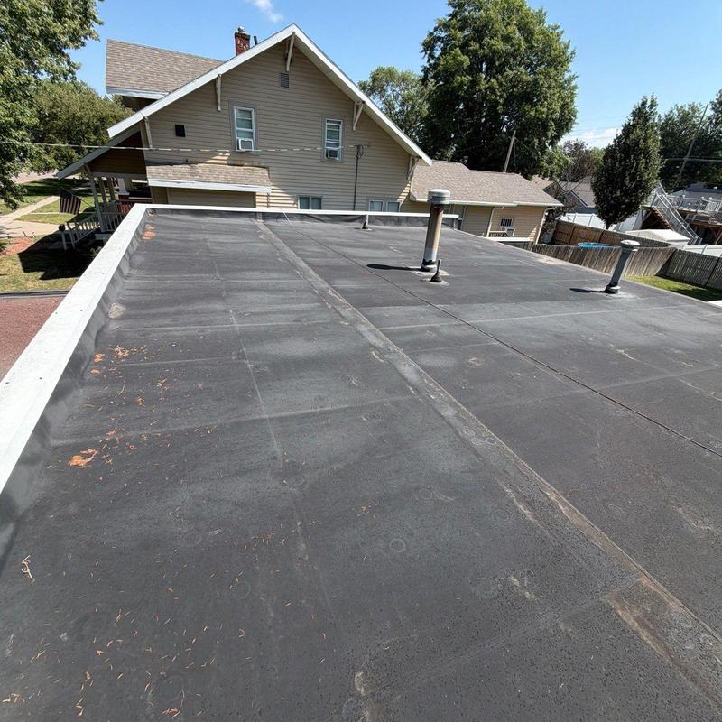 Flat roof membrane with vent pipes, no damage found Flat roof membrane with vent pipes, no damage found