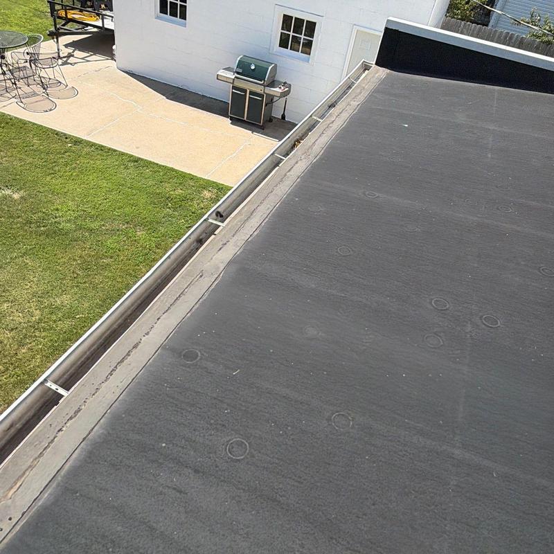 Flat rubber roof and metal gutter inspection Flat rubber roof and metal gutter inspection