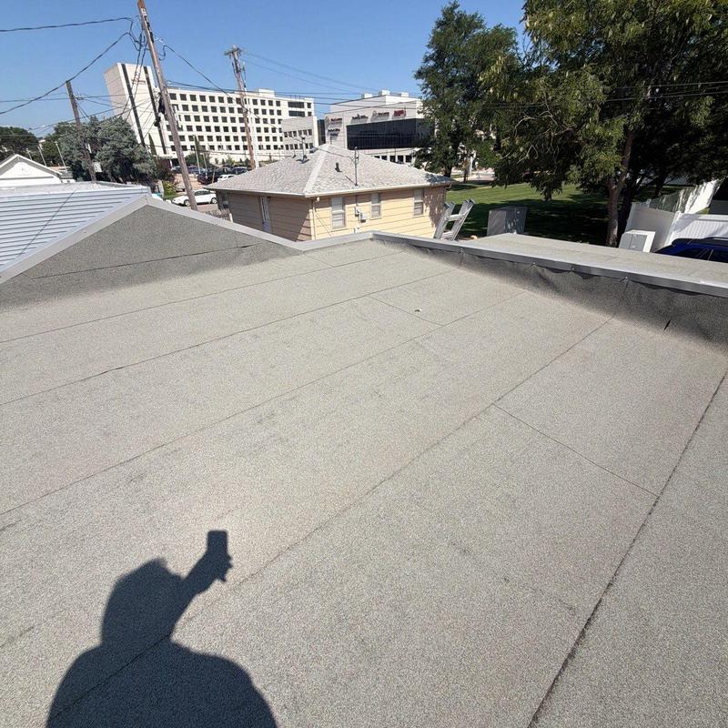 Flat roof surface inspection with no damage visible Flat roof surface inspection with no damage visible