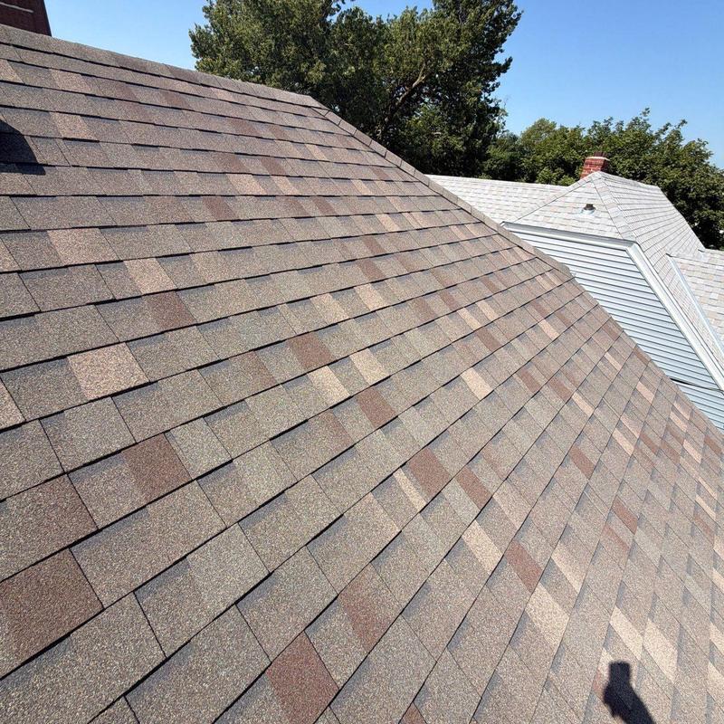 Asphalt shingle roof close-up with no visible damage Asphalt shingle roof close-up with no visible damage