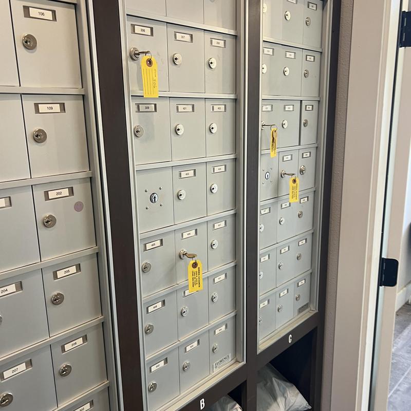 Mailbox locks with new keys tagged in apartment lobby Mailbox locks with new keys tagged in apartment lobby