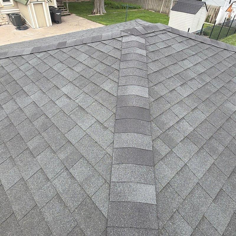Asphalt shingle roof ridge with no visible damage Asphalt shingle roof ridge with no visible damage
