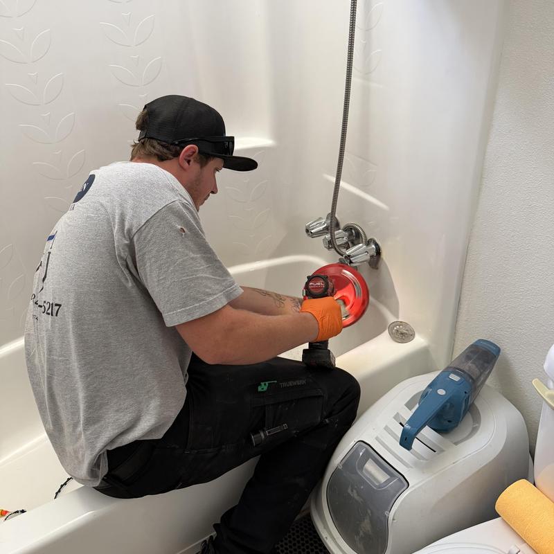Tub drain clog clearing with roto rooter tool