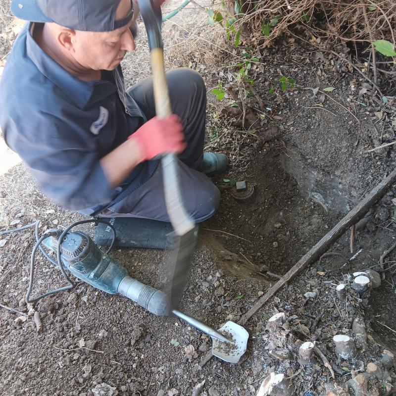 Trenchless sewer line access excavation in dirt Trenchless sewer line access excavation in dirt