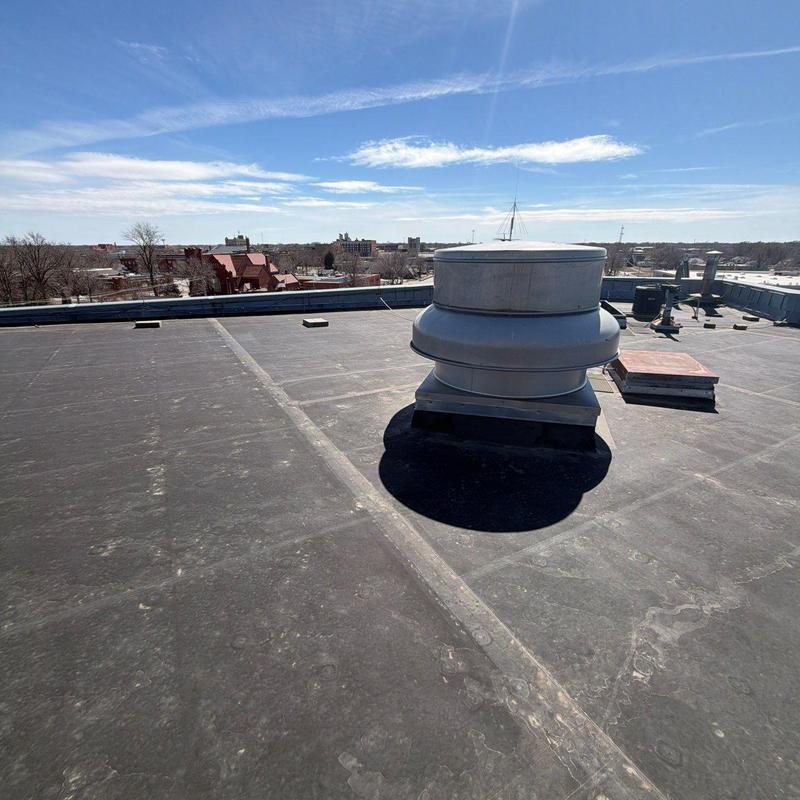 Flat roof with ventilation fan and no damage detected Flat roof with ventilation fan and no damage detected