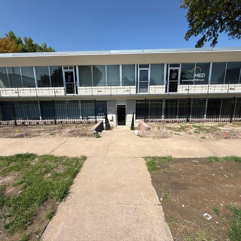 Concrete walkway and building exterior under clear sky Concrete walkway and building exterior under clear sky