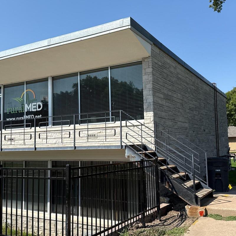 Flat roof inspection on commercial building exterior Flat roof inspection on commercial building exterior