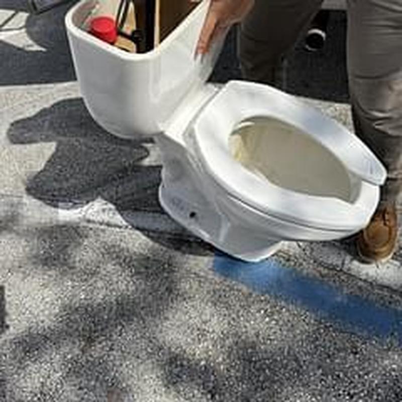 Toilet tank and bowl replacement on pavement Toilet tank and bowl replacement on pavement