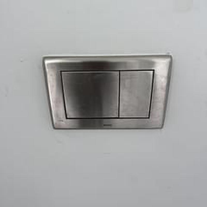 Toto wall-hung toilet flush plate on wall Toto wall-hung toilet flush plate on wall