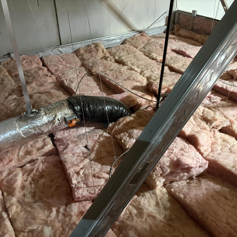HVAC duct with insulation and damper in attic space HVAC duct with insulation and damper in attic space